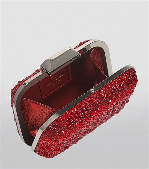 Red Embellished Clutch Bag .